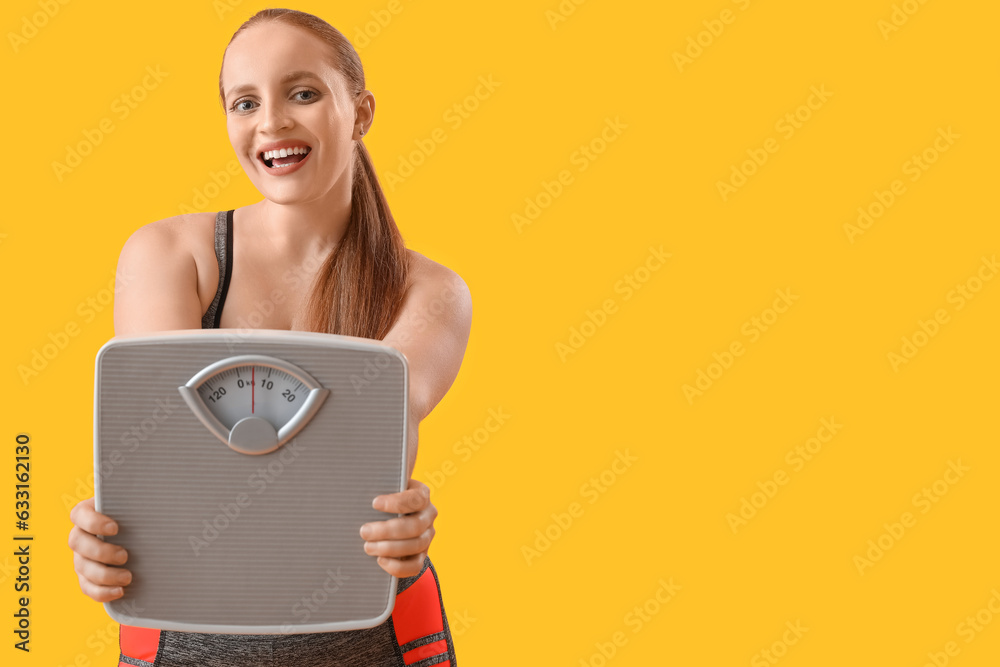 Young overweight woman with scales on yellow background