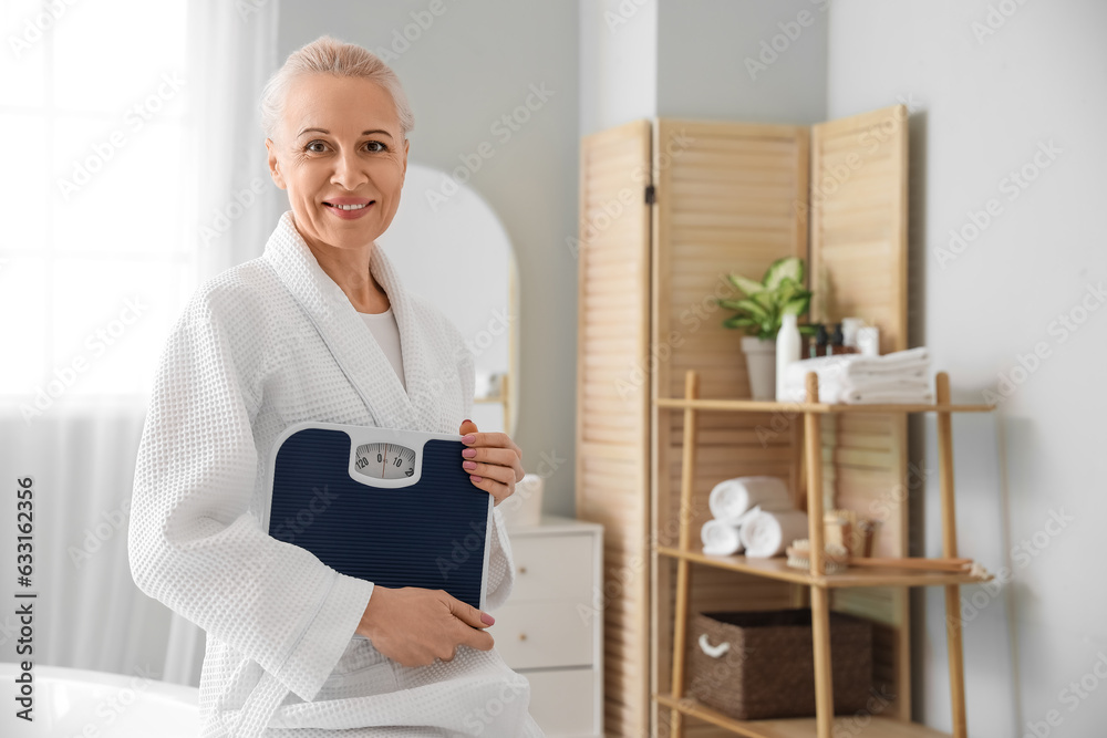 Mature woman with scales in bathroom