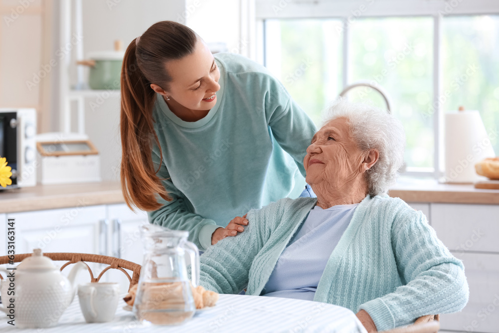 Senior woman with her granddaughter in kitchen