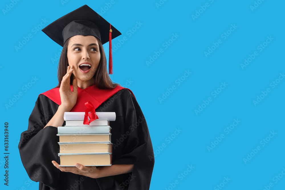 Female graduate student with diploma and books on blue background