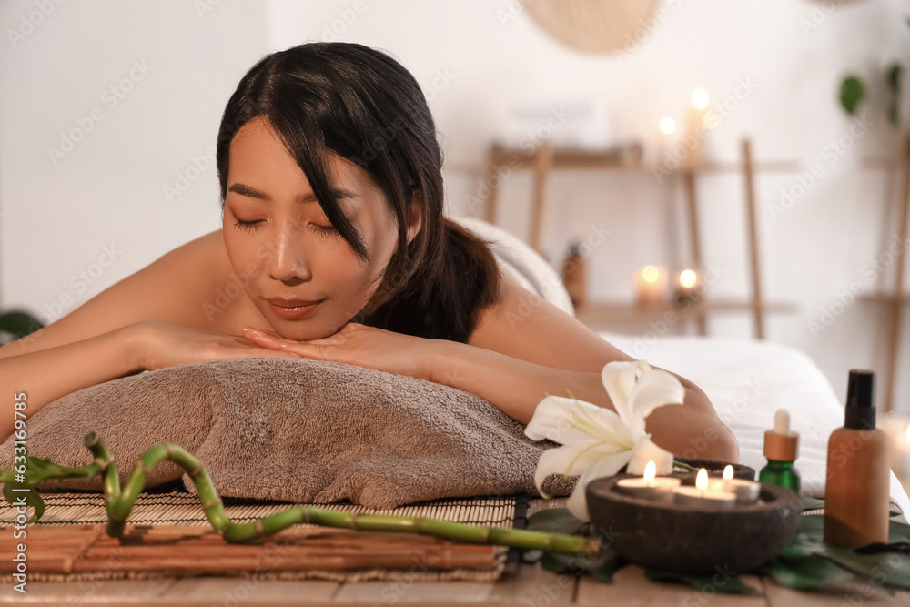 Pretty young Asian woman in spa salon