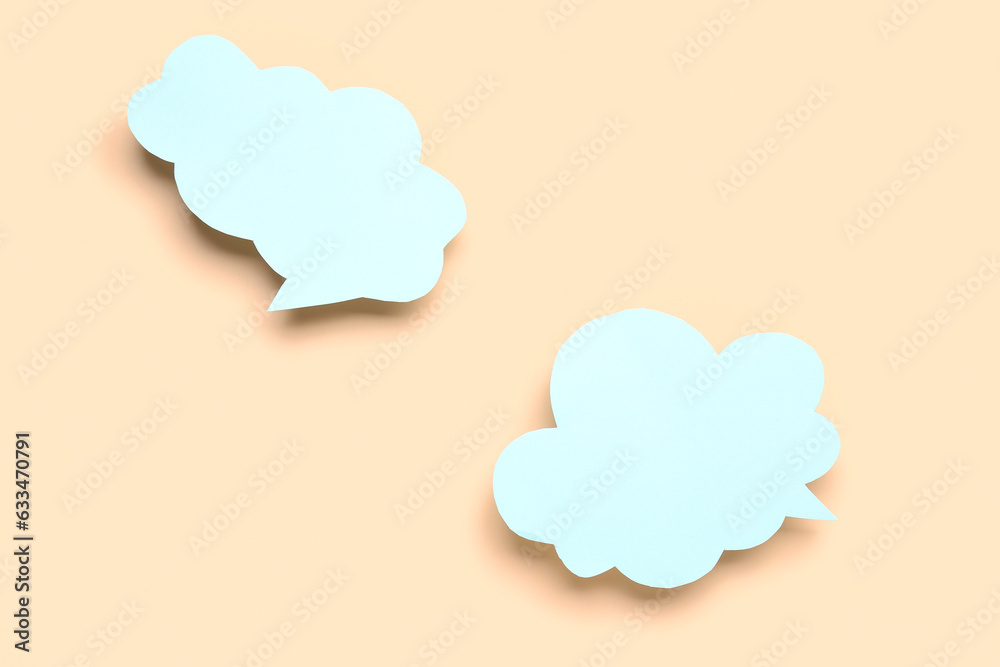 Blank speech bubbles on beige background