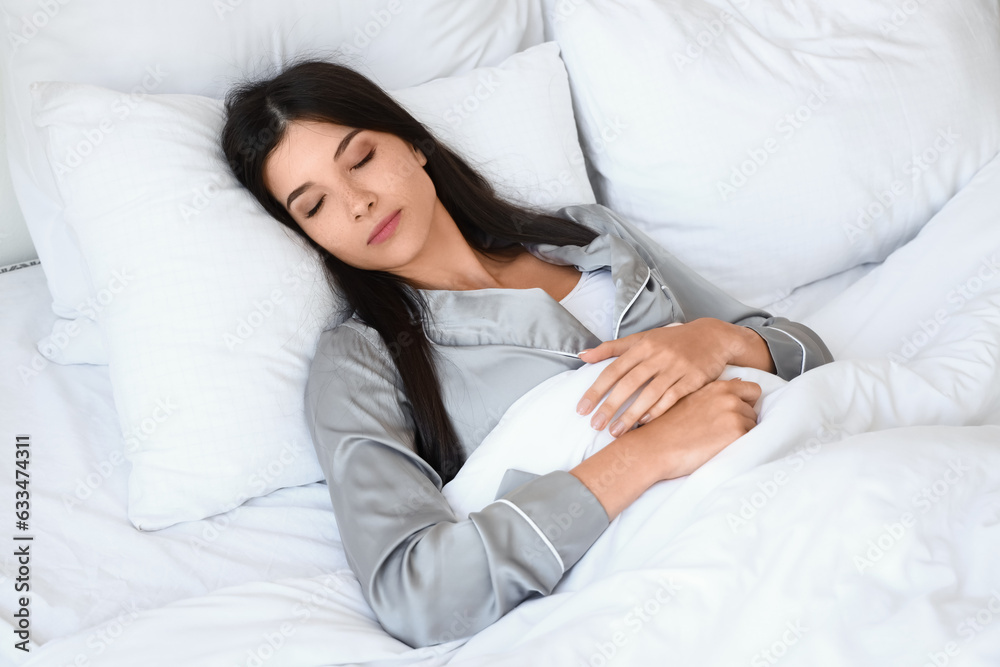 Morning of young woman sleeping in bed