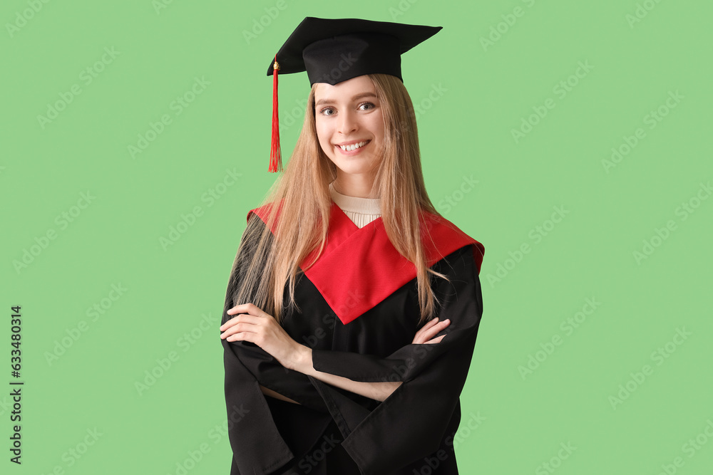 Female graduate student on green background