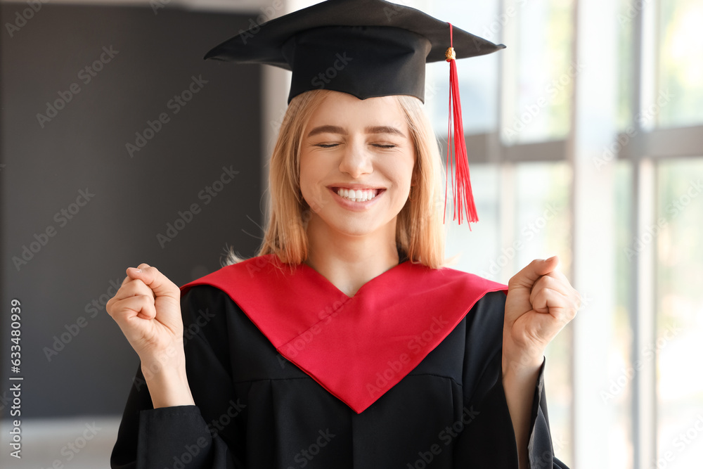 Female graduate student near window in room