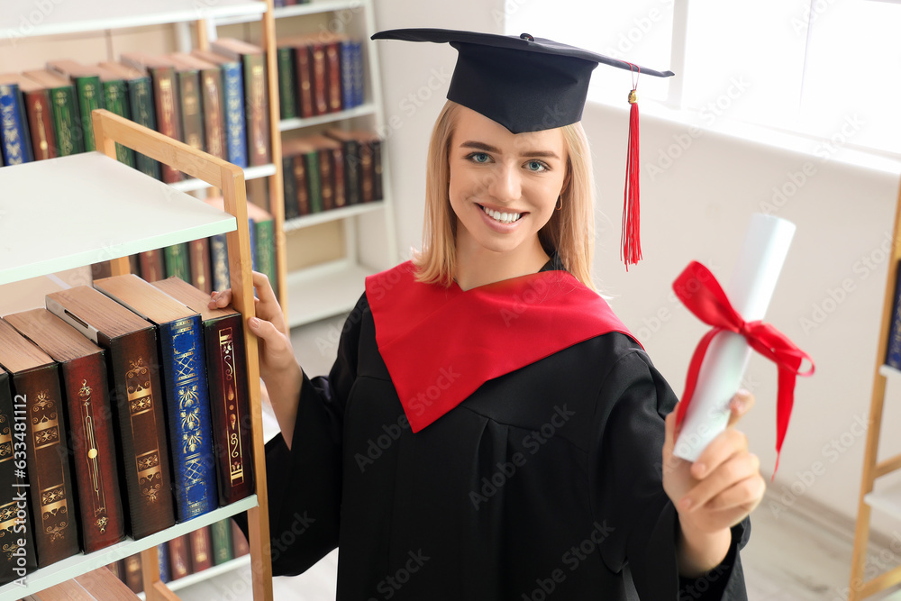 Female graduate student with diploma in library