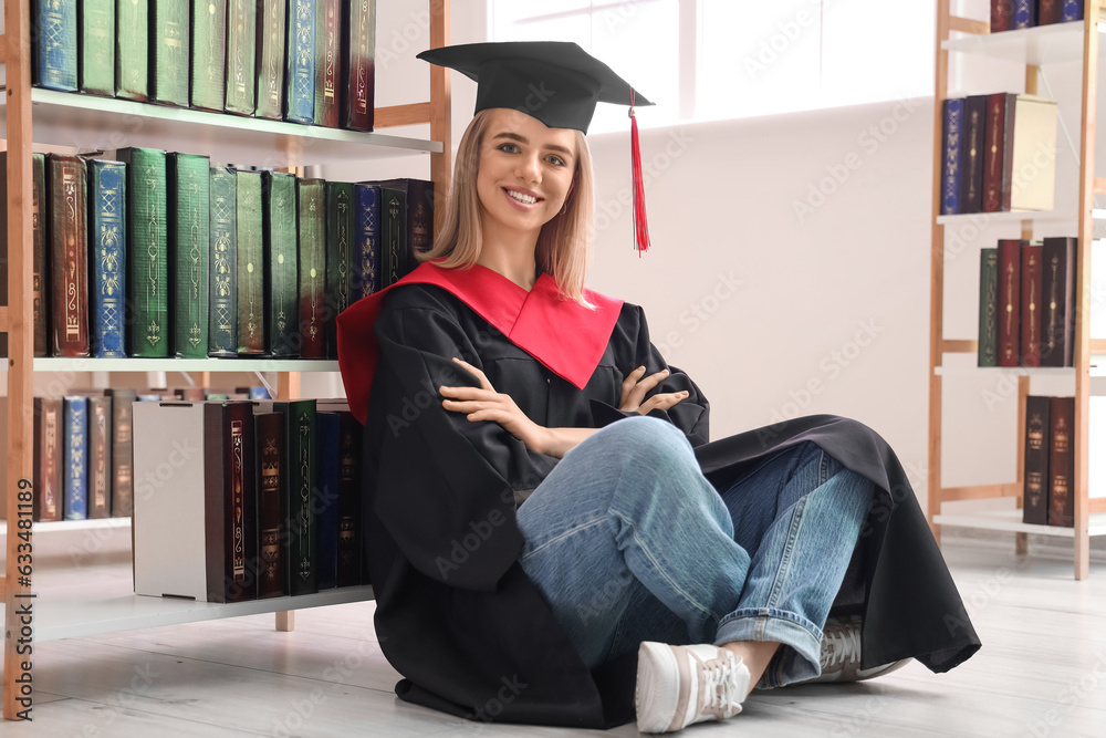 Female graduate student sitting in library