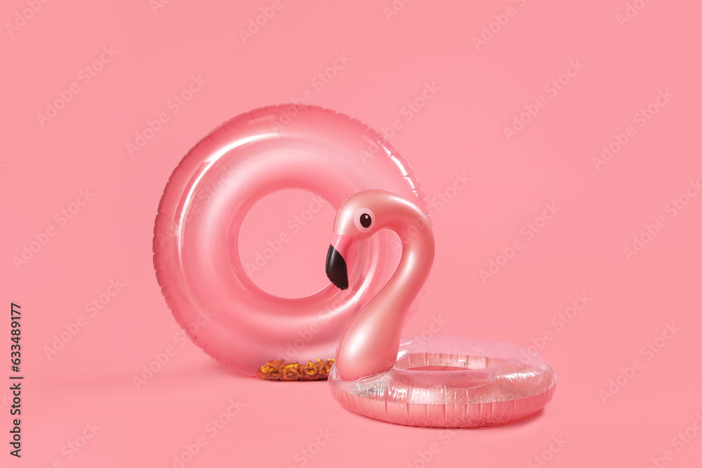 Inflatable rings on pink background