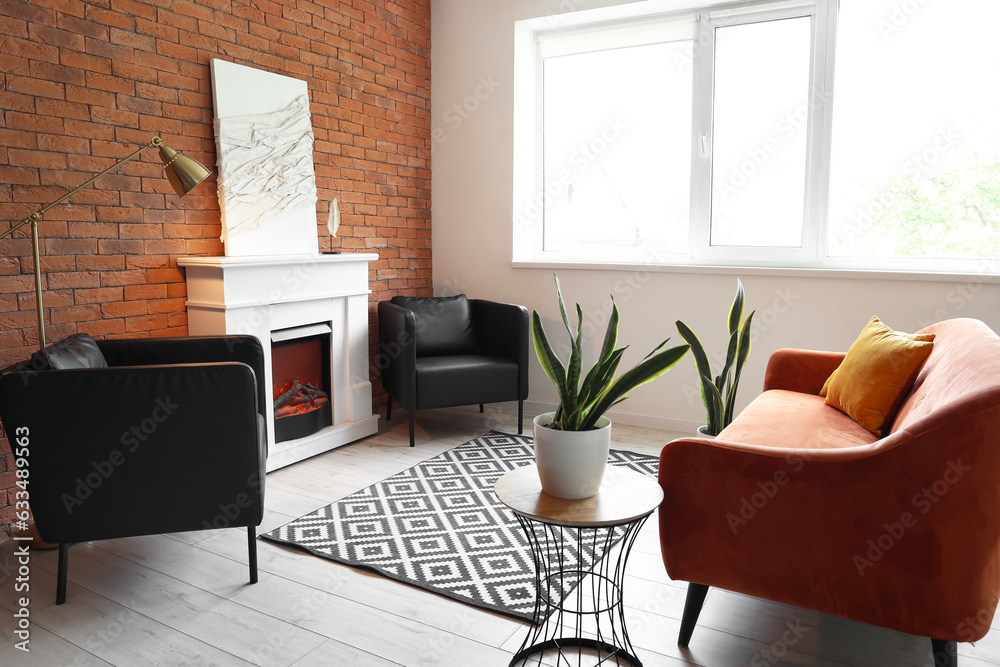 Interior of modern living room with stylish fireplace and sofa