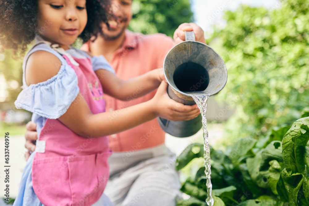 Gardening, father and daughter water plants, teaching and learning with growth in nature together. B