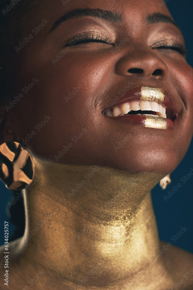 Smile, gold and makeup with face of black woman in studio for creative, luxury and cosmetics. Glow, 