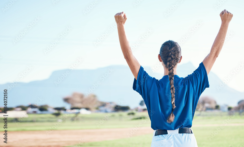 Woman, fist pump and winning, softball and athlete on outdoor pitch, celebration and success with sp