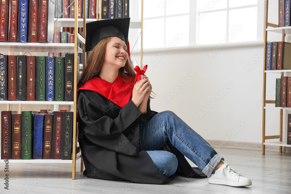 Female graduate student with diploma in library