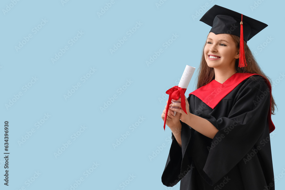 Female graduate student with diploma on blue background