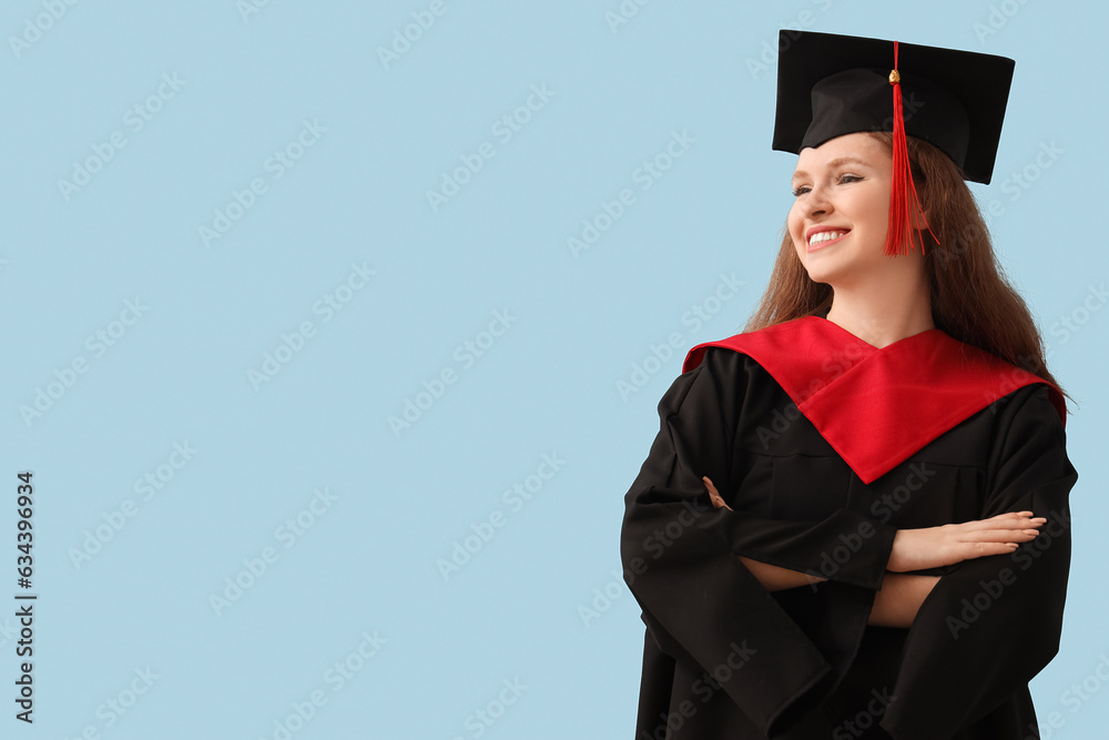 Female graduate student on blue background