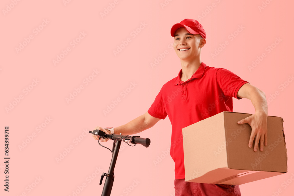 Young courier with parcel and scooter on pink background