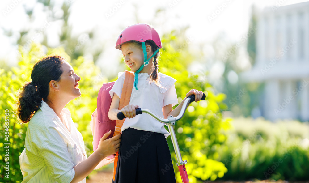 Girl in safety helmet with mother