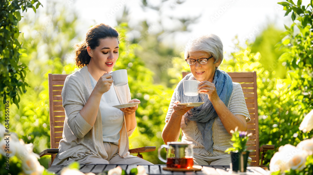 women drinking tea in the garden