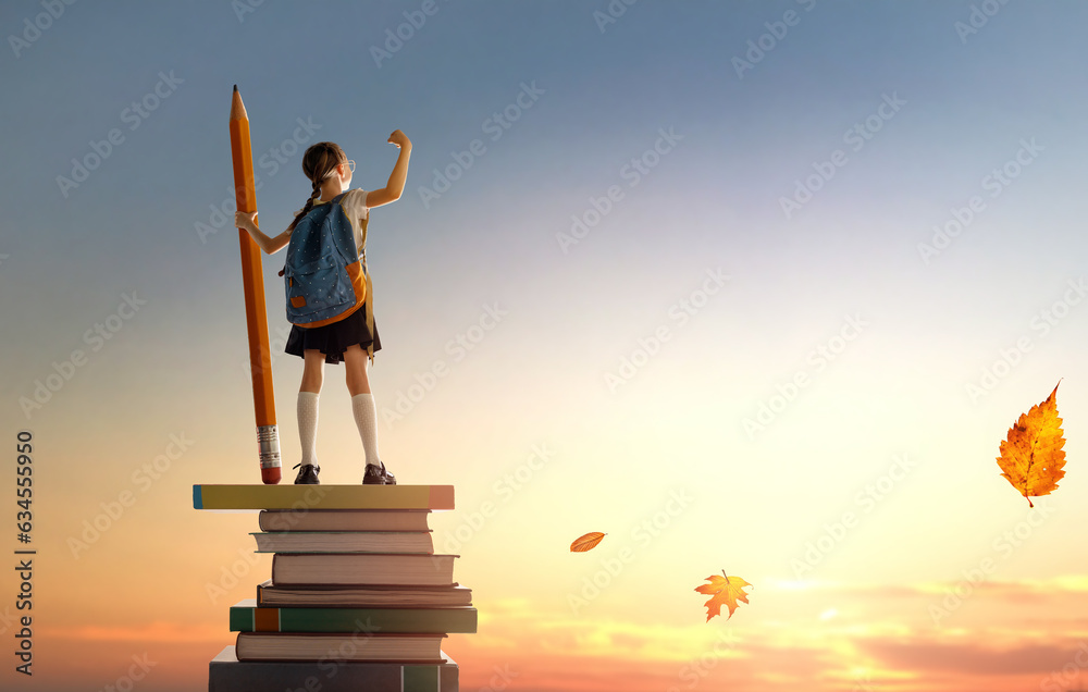 child on the tower of books