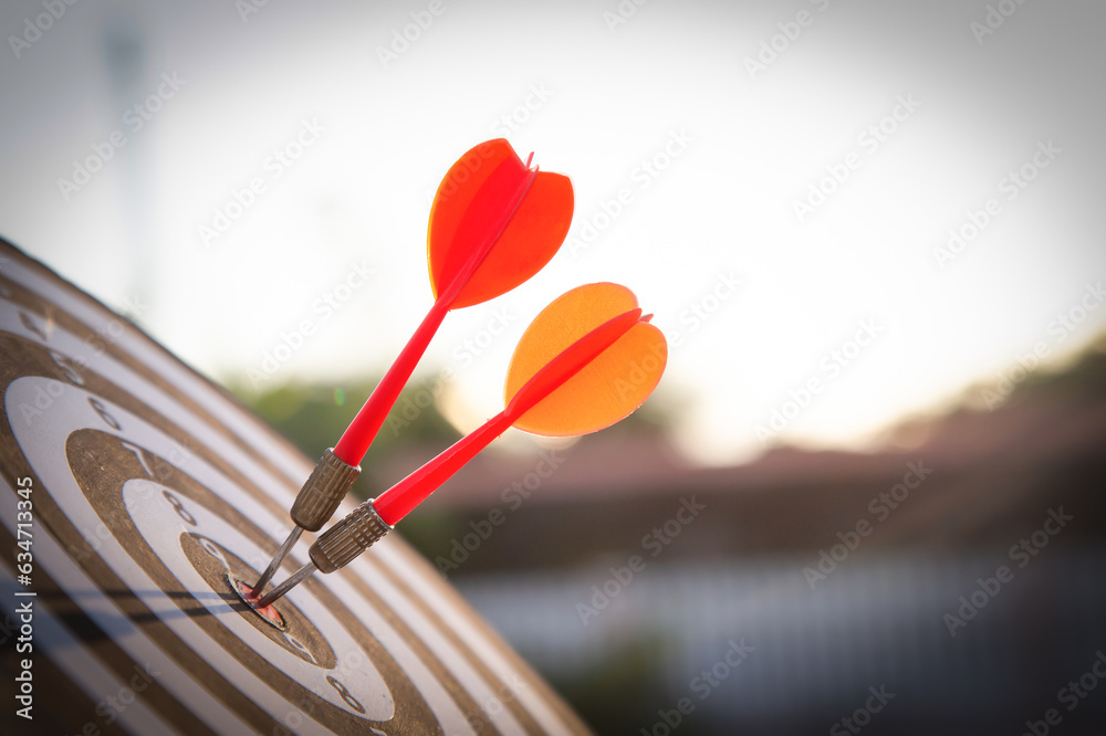 Close up shot red darts arrows in the target.