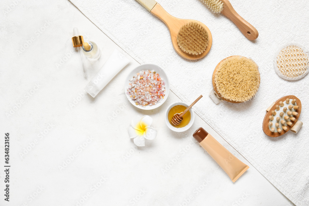 Composition with spa supplies and cosmetics on light background