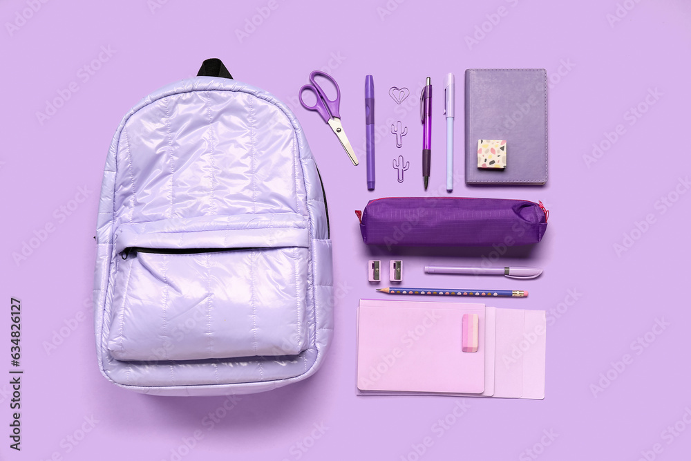 Stylish school backpack with pencil case and different stationery supplies on lilac background