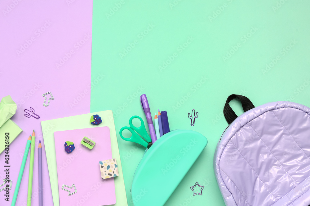 Stylish school backpack and pencil case with different stationery supplies on colorful background