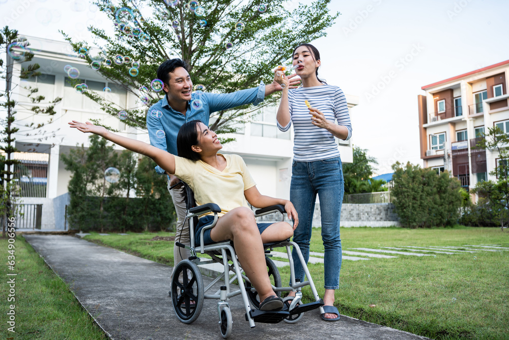 Group of Asian young man and woman friends walking together in garden. 