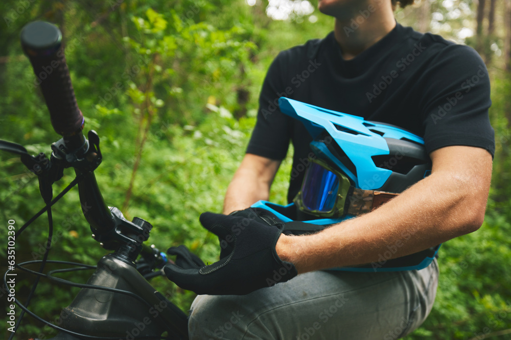 Mountain bike, man and helmet, glove in forest and sports, adventure and fitness in nature outdoor. 