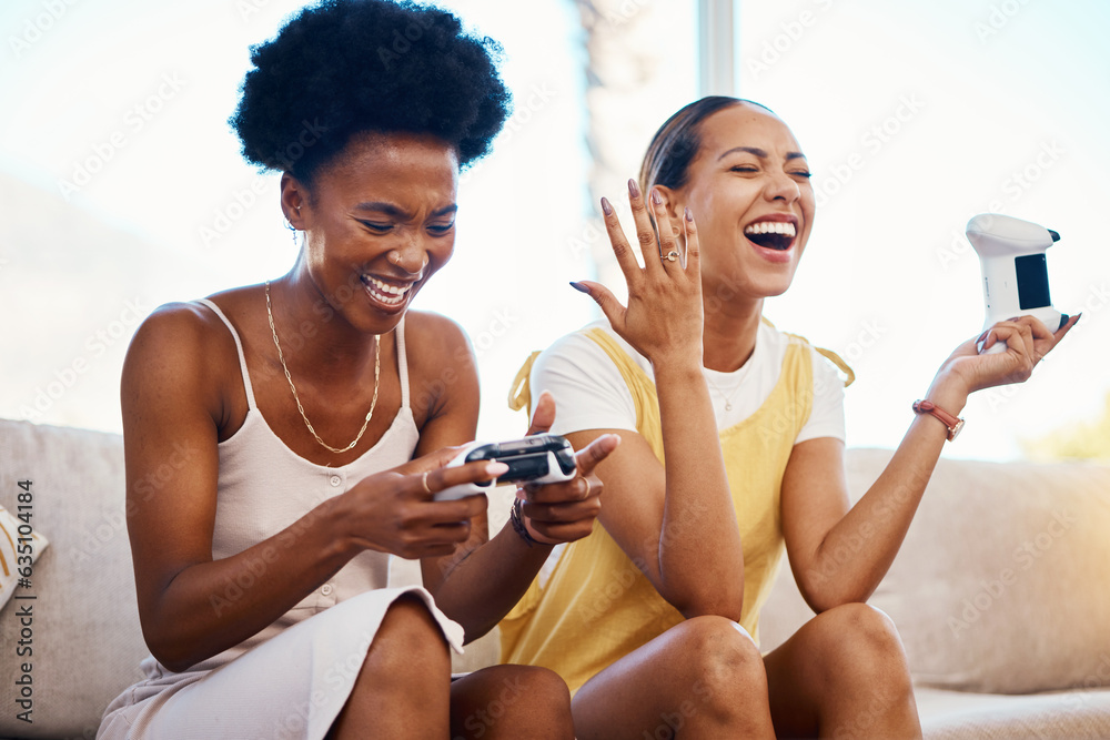 Women on sofa playing video game, laughing and relax in home living room together on internet with c