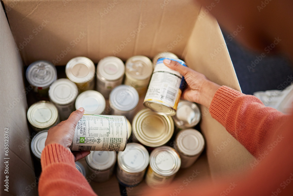 Donation, food in cans in box and hands of man checking stock, decision and volunteer with ngo help.