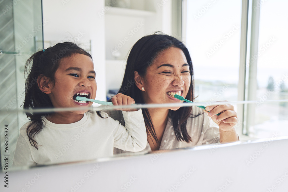 Mother, child and brushing teeth in morning routine, dental hygiene or healthcare together by mirror