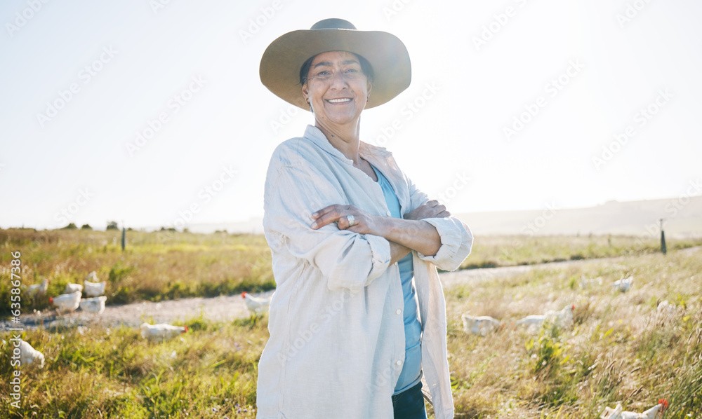 Farmer, mature woman and agriculture, arms crossed on field and sustainability, land and livestock. 