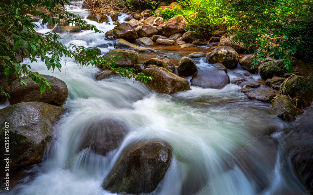 beautiful natural stream waterfall and green forest in the  mountain concept traveling and relaxing 