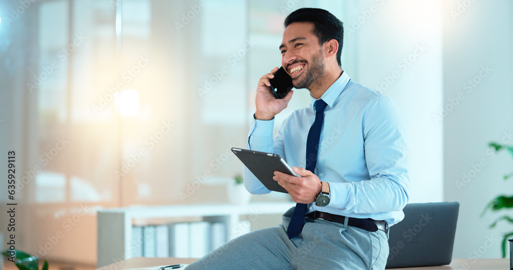 Business man talking on a phone while browsing on a digital tablet in an office. Dedicated sales exe