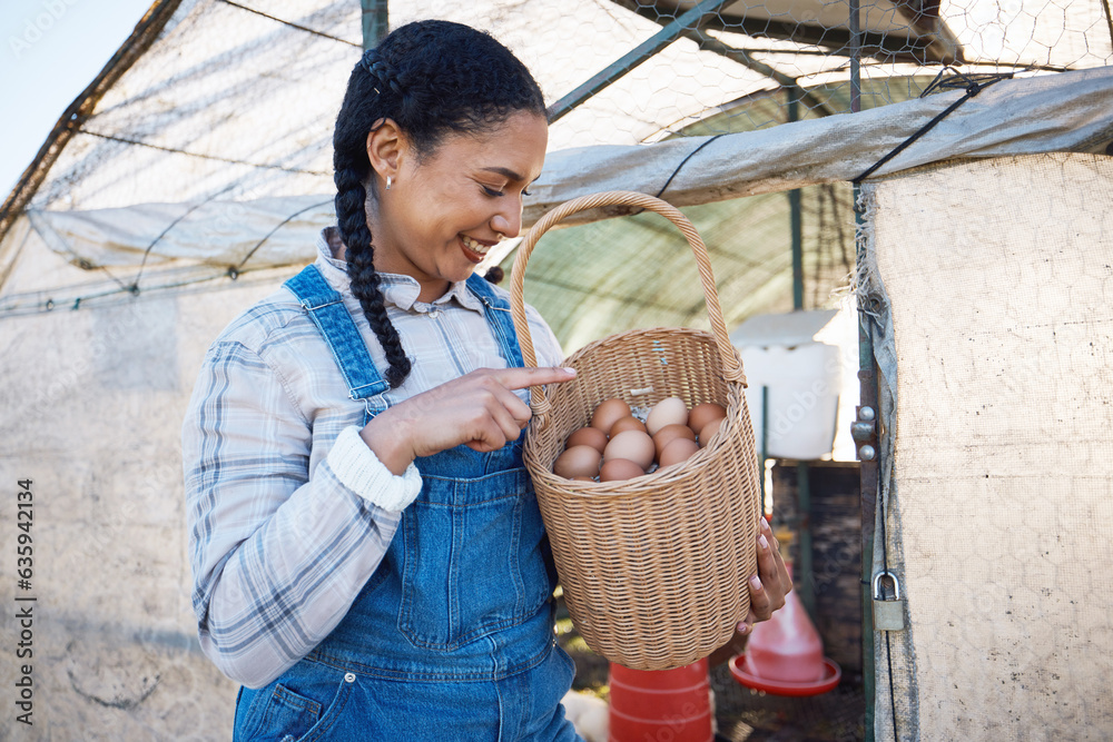 Happy woman checking eggs in basket at farm chicken coop, inspection and countryside greenhouse at s