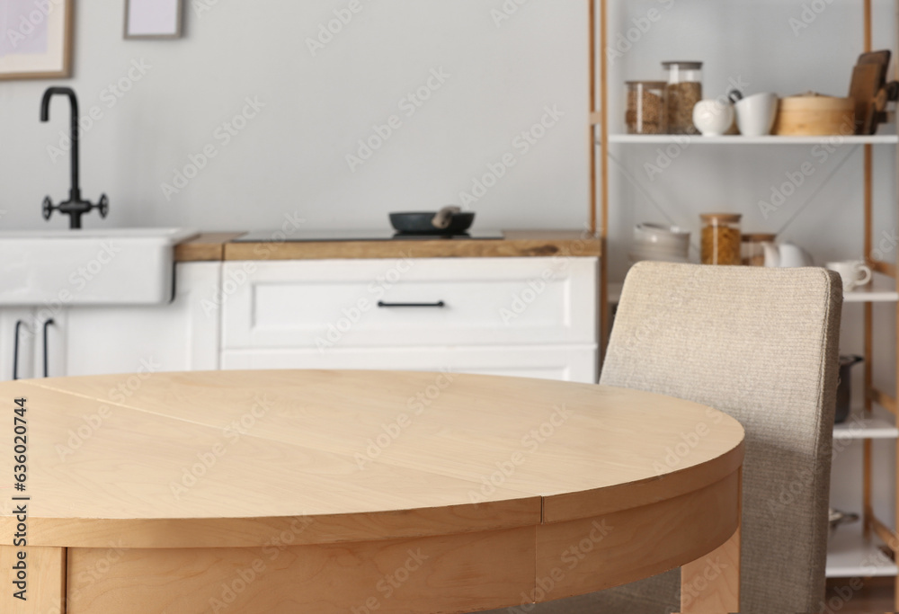 Clean wooden table in interior of kitchen