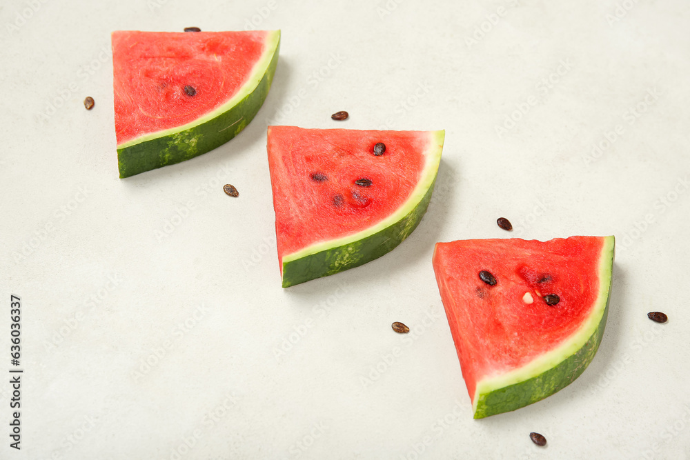 Composition with pieces of fresh ripe watermelon on light background