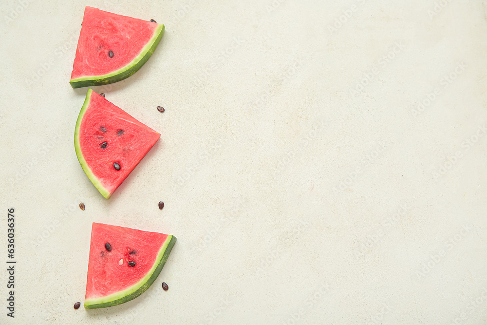 Composition with pieces of fresh ripe watermelon on light background