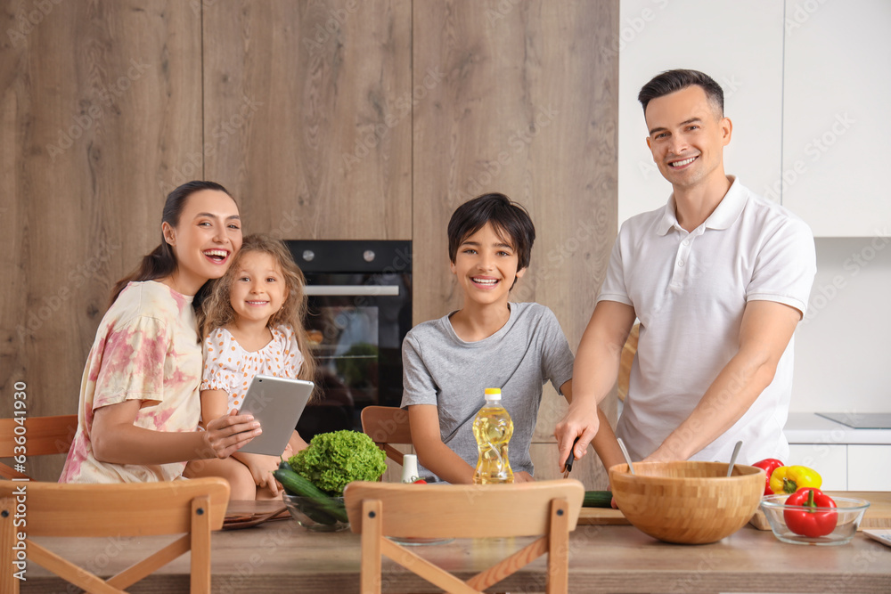 Little children with their parents cooking in kitchen