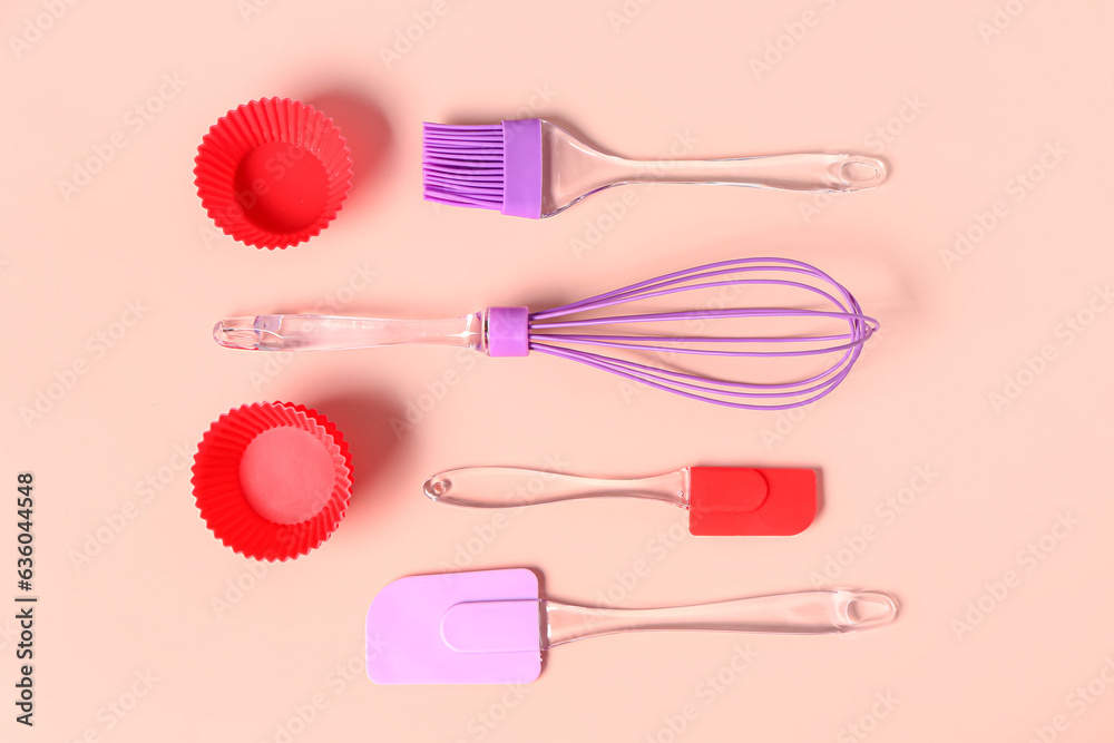 Baking utensils on pink background