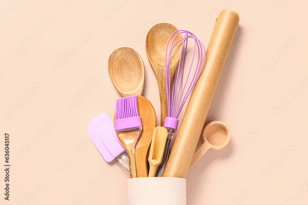 Baking utensils on beige background