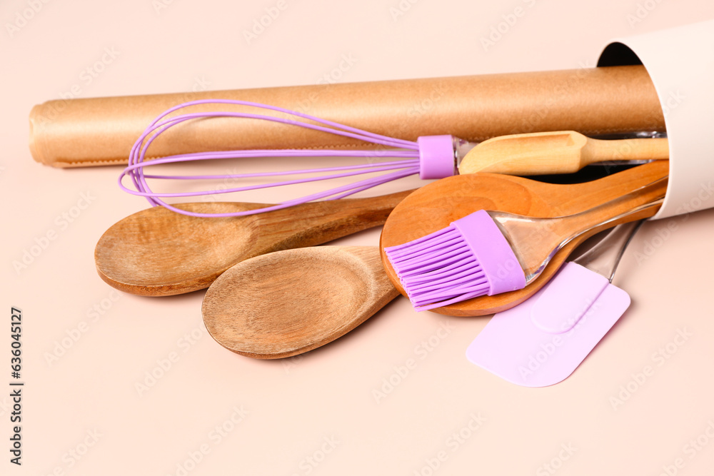 Baking utensils on beige background