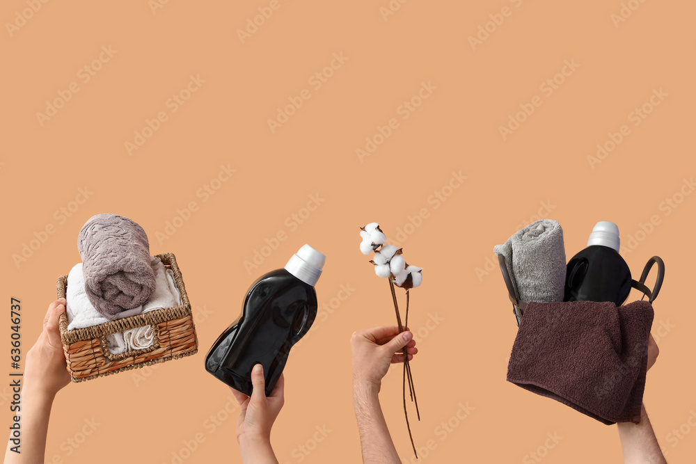 People with laundry detergents, baskets of clean towels and cotton flowers on beige background