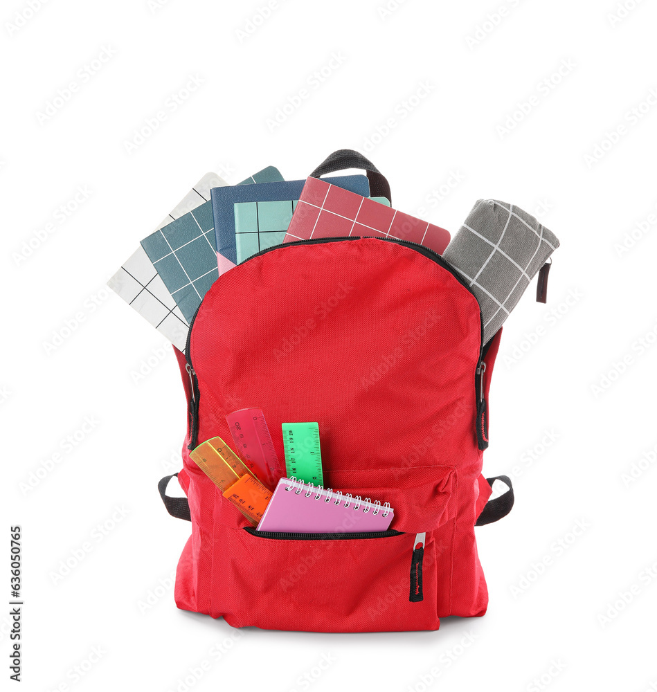 Red school backpack with different stationery on white background