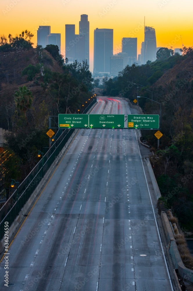 Dawning Urban Energy: 4K Image of Los Angeles Downtown and Morning Traffic at Sunrise