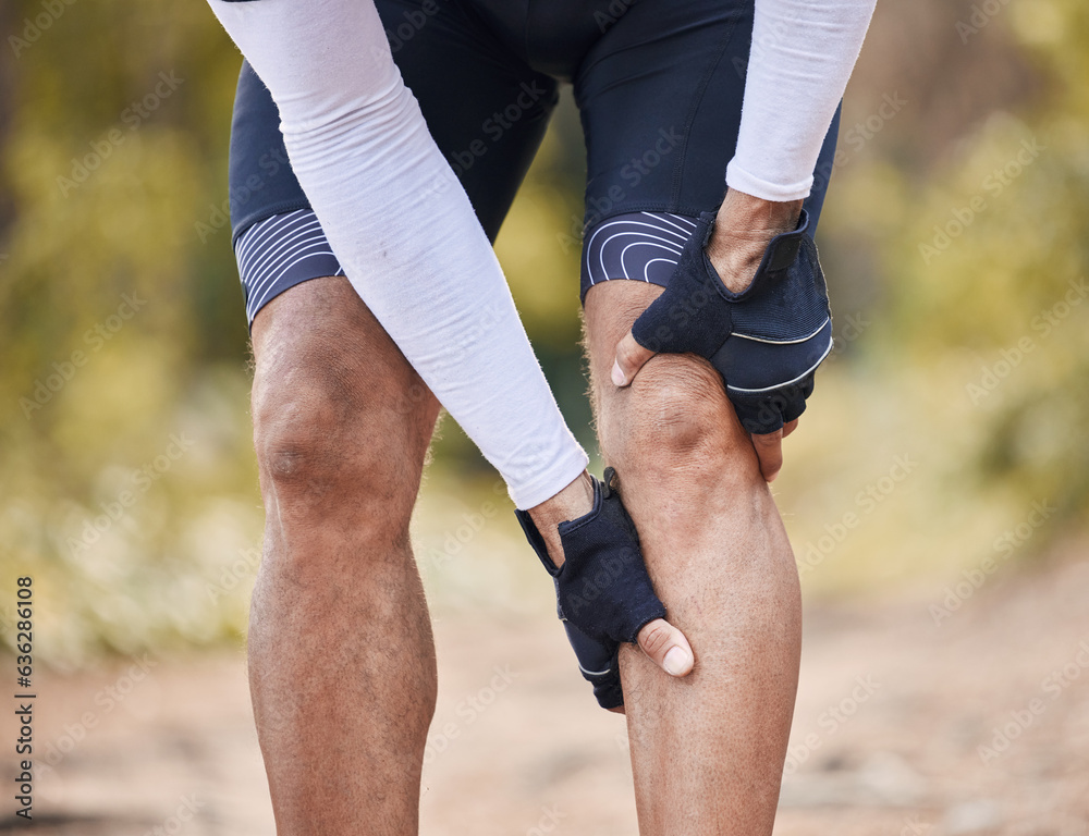 Fitness, knee pain and man hands in forest with cycling, sports or injury, muscle or joint accident 