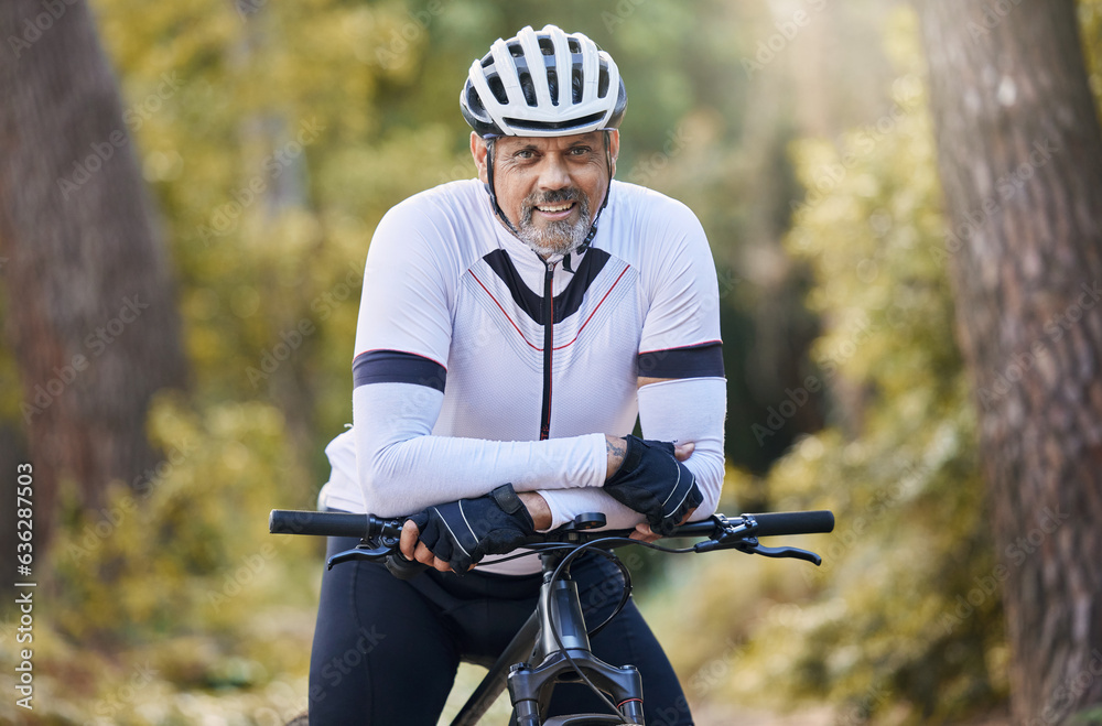 Fitness, portrait and senior man with bicycle in a forest for cycling, sports or training for off ro