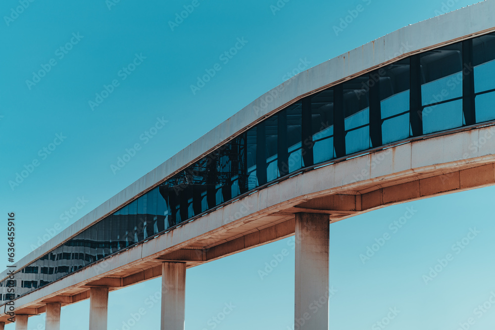 Pedestrian overpass on blue sky background