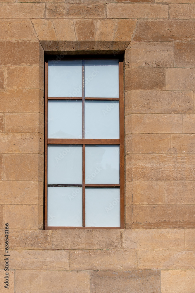 Beautiful architecture of old windows in brick houses.